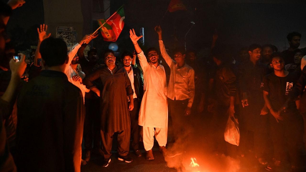 Supporters of Pakistan's former prime minister Imran Khan, take part in a protest against the assassination attempt on Khan, outside the hospital where Khan is admitted, in Lahore on November 3, 2022. Credit: AFP Photo