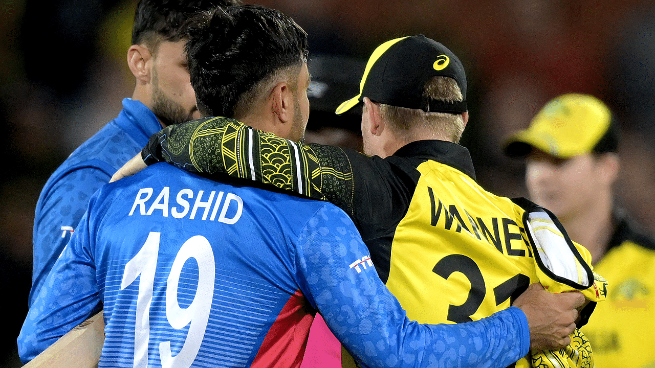 Australia's David Warner (R) embraces Afghanistan's Rashid Khan after the ICC men's Twenty20 World Cup 2022 cricket match. Credit: AFP Photo