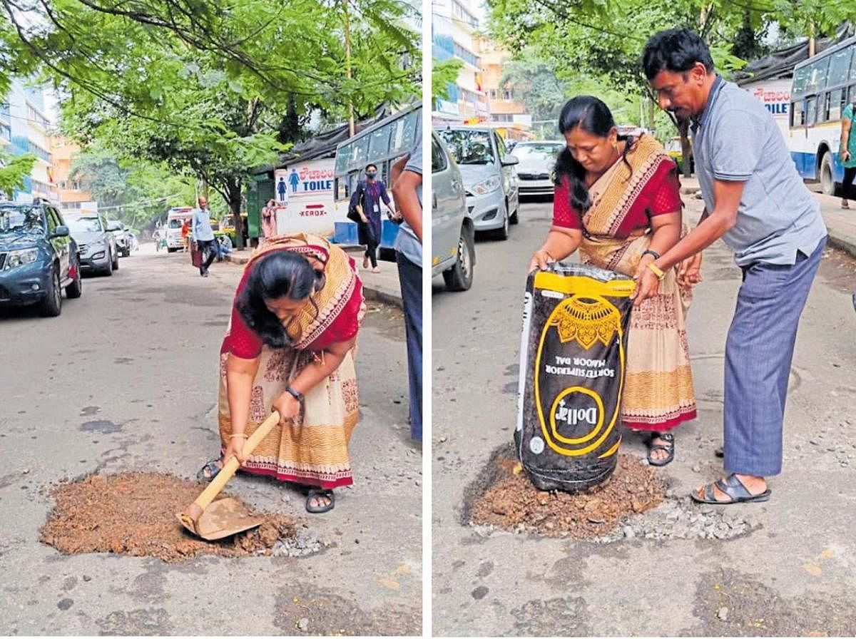 M Nagamani and her husband filling a pothole in Malleswaram with a mixture of asphalt waste and mud.