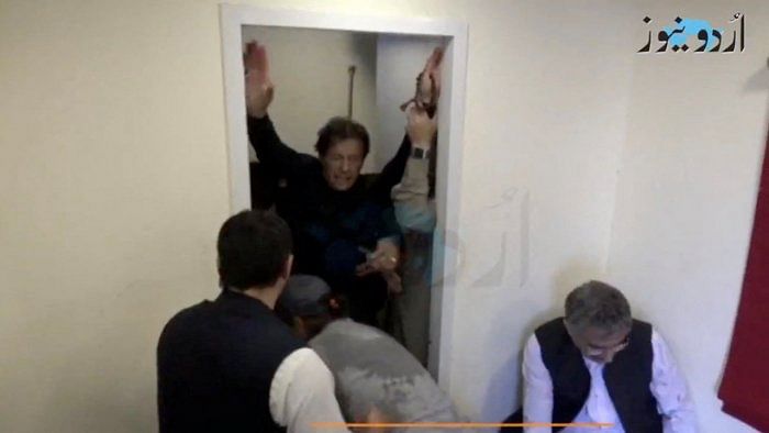 Former Pakistani Prime Minister Imran Khan is helped after he was shot in the shin in Wazirabad, Pakistan November 3, 2022 in this still image obtained from video. Credit: Urdu Media via Reuters