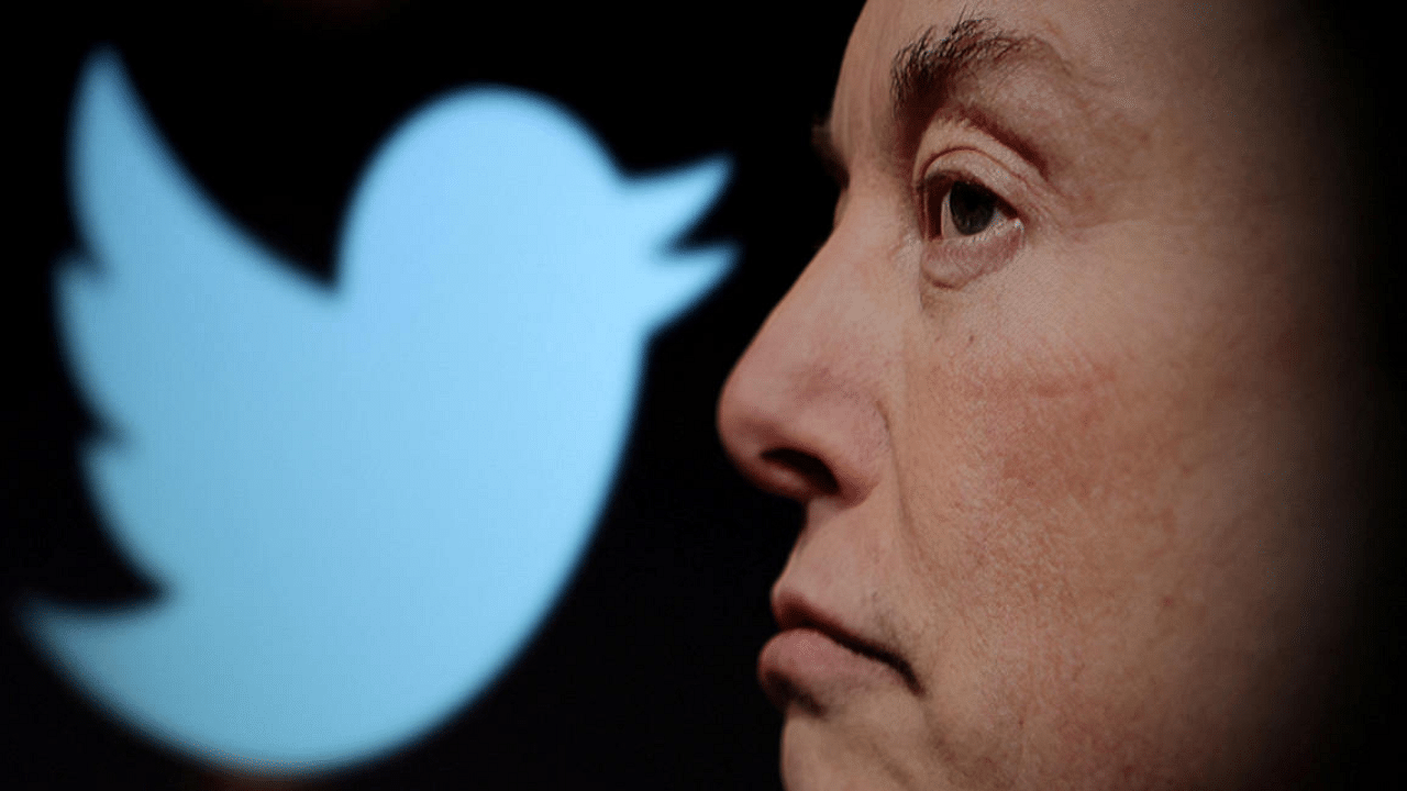  Twitter logo and a photo of Elon Musk are displayed through magnifier in this illustration. Credit: Reuters Photo