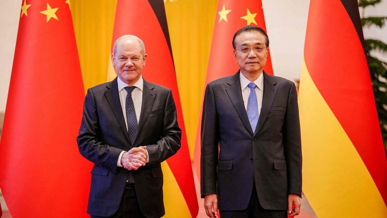 Chinese Premier Li Keqiang (R) meets visiting German Chancellor Olaf Scholz at the Great Hall of the People in Beijing. Credit: AFP Photo