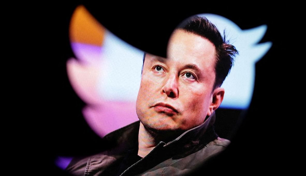 Elon Musk's photo is seen through a Twitter logo in this illustration. Credit: REUTERS FILE PHOTO 