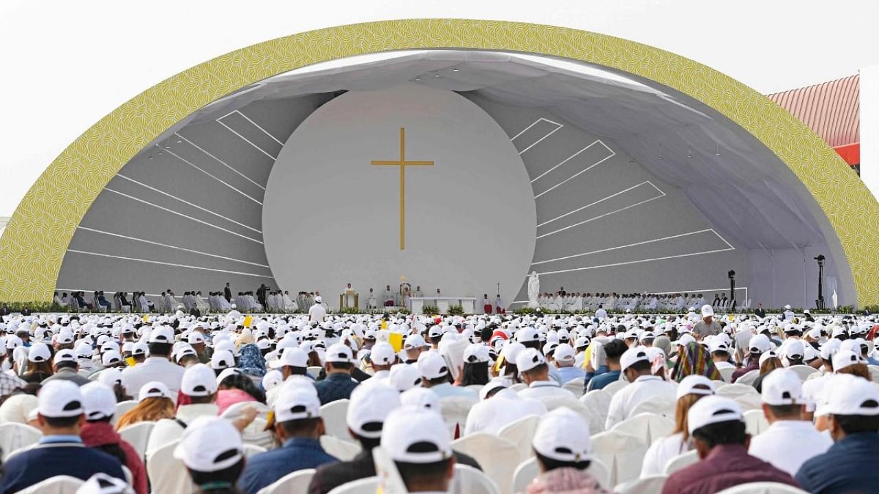 Worshippers attend a mass held by Pope Francis at Bahrain National Stadium in Riffa, near the capital Manama. Credit: AFP Photo