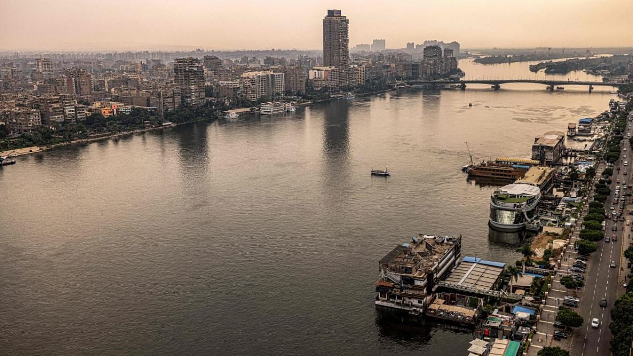 This picture taken on November 1, 2022 shows a view of the Nile river between Egypt's capital Cairo (L) and its twin city of Giza (R). Credit: AFP Photo