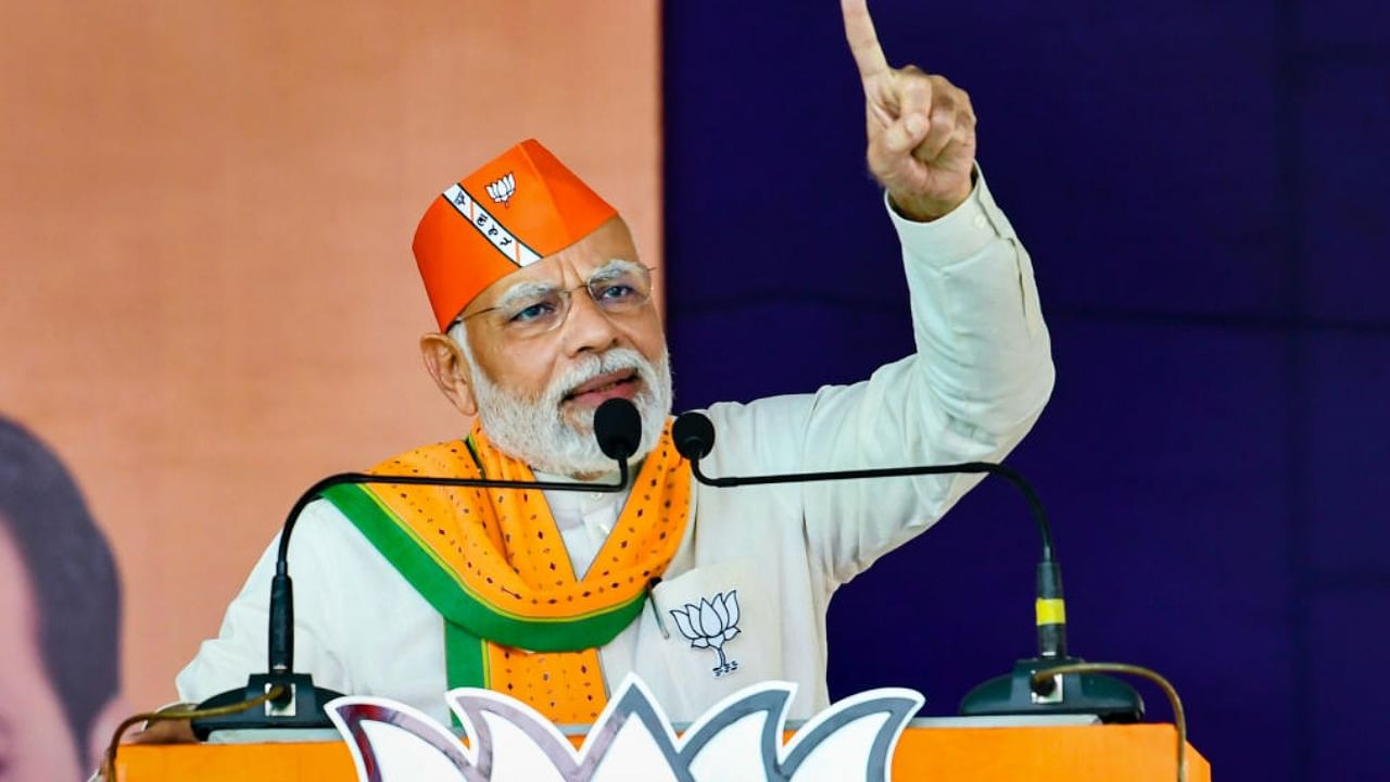 Prime Minister Narendra Modi addresses during a Bharatiya Janata Party (BJP) election campaign rally for Gujarat Assembly elections, in Valsad. Credit: PTI Photo