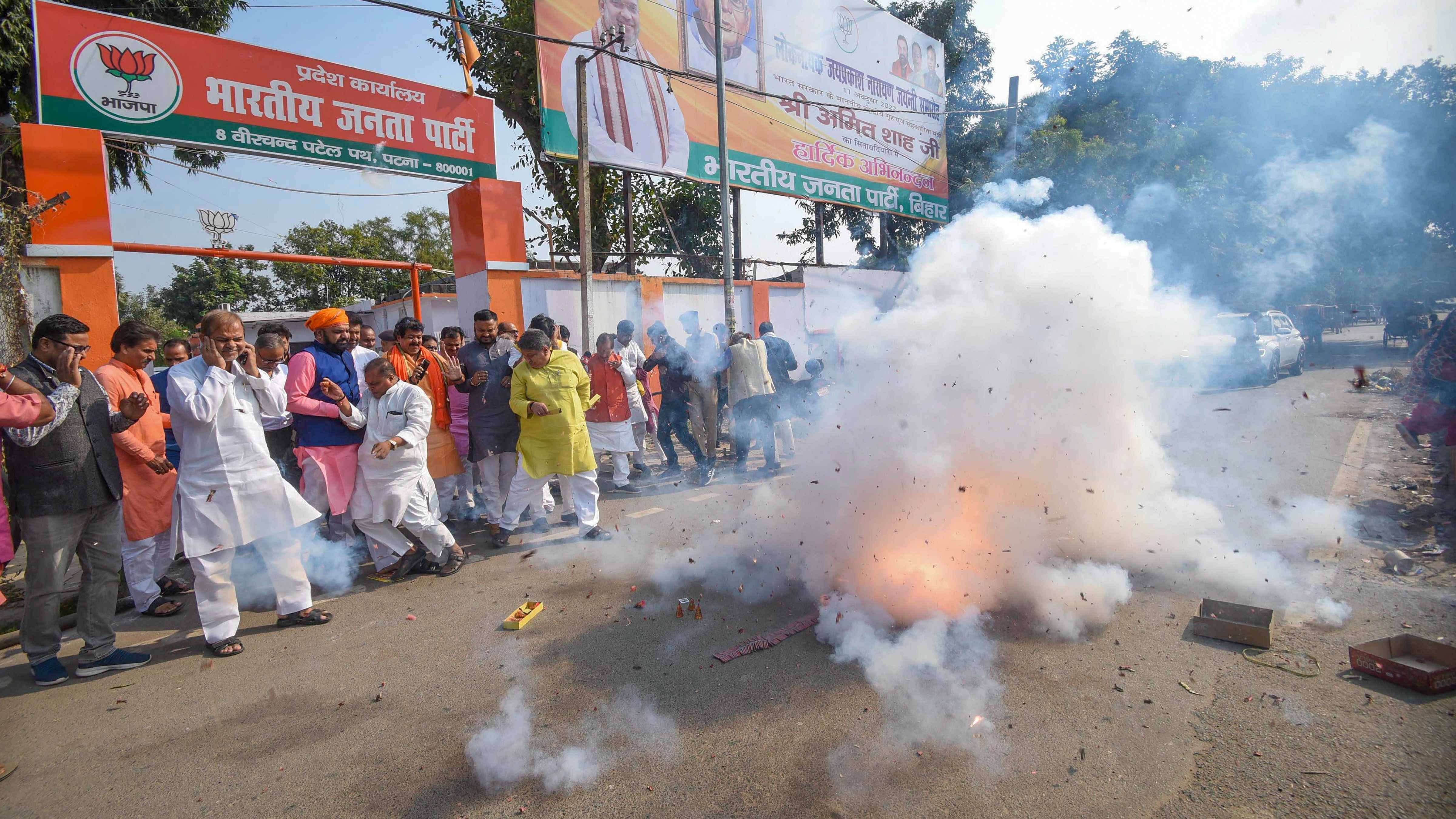 Supporters burst firecrackers to celebrate after BJP candidate Kusum Devi won from Gopalganj. Credit: PTI Photo