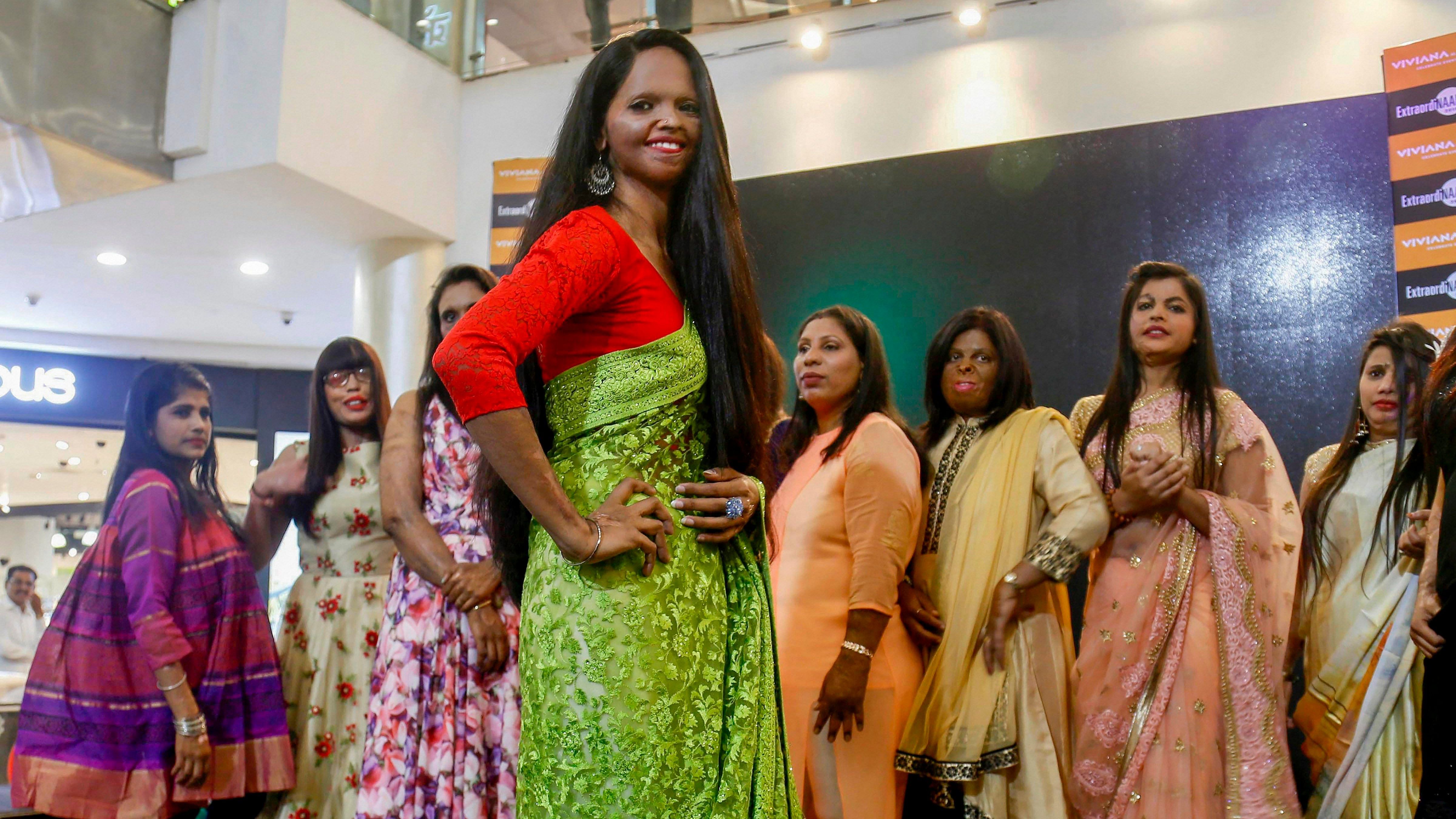 Acid attack survivors walk the ramp during a fashion show on the occasion of International Women's Day, in Thane. Credit: PTI Photo