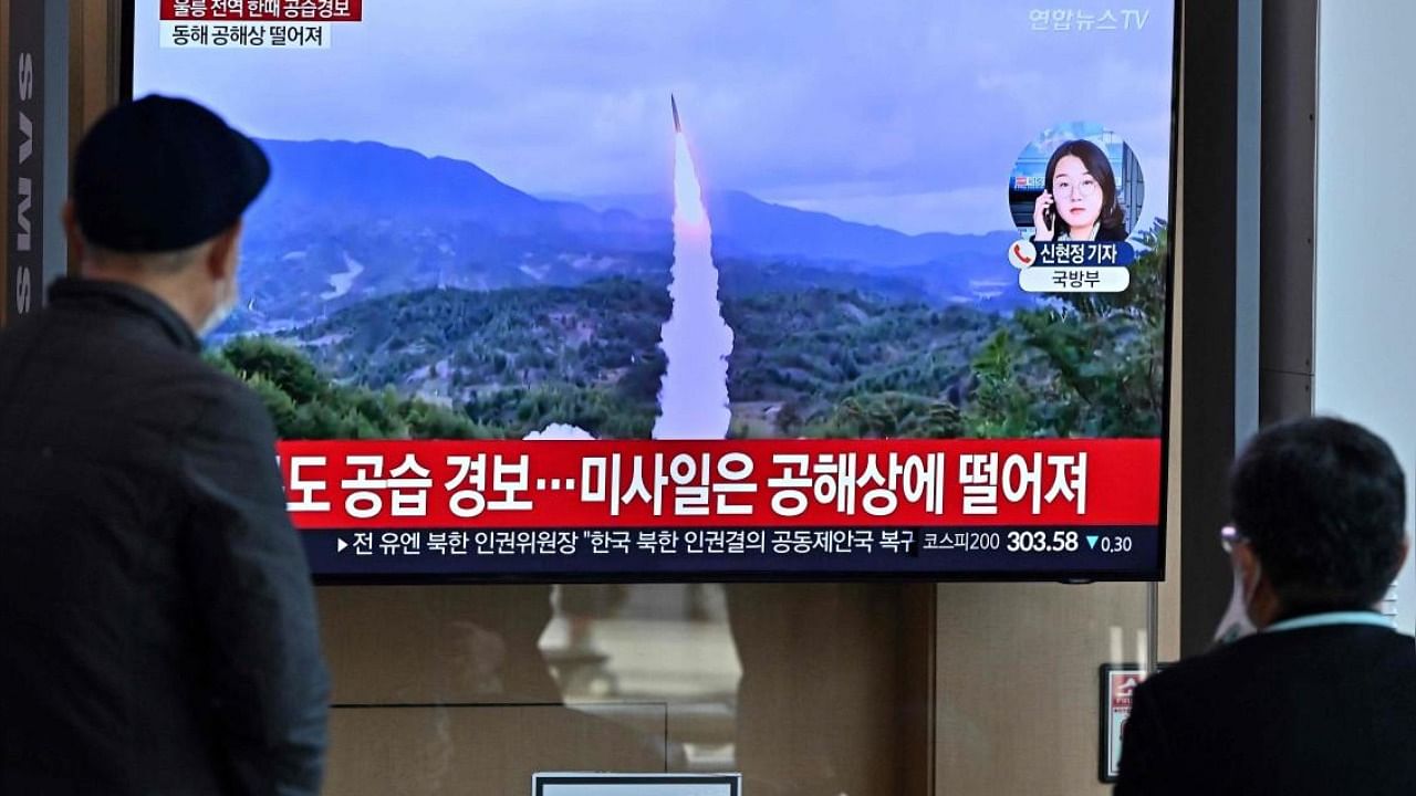 People in Seoul watch a TV showing a news broadcast with file footage of a North Korean missile test. Credit: AFP Photo