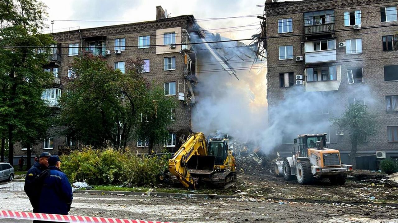  A handout photo by the National Police of Ukraine shows a residential building damaged after a strike on Zaporizhzhia. Credit: AFP File Photo