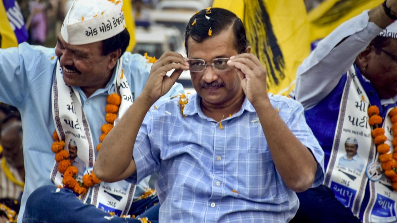 Delhi Chief Minister Arvind Kejriwal during a roadshow ahead of Gujarat Assembly elections. Credit: PTI Photo