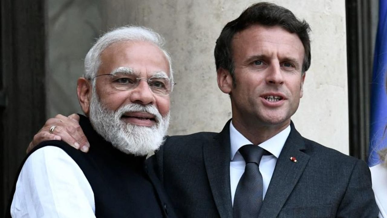 France's President Emmanuel Macron with India's Prime Minister Narendra Modi. Credit: AFP Photo