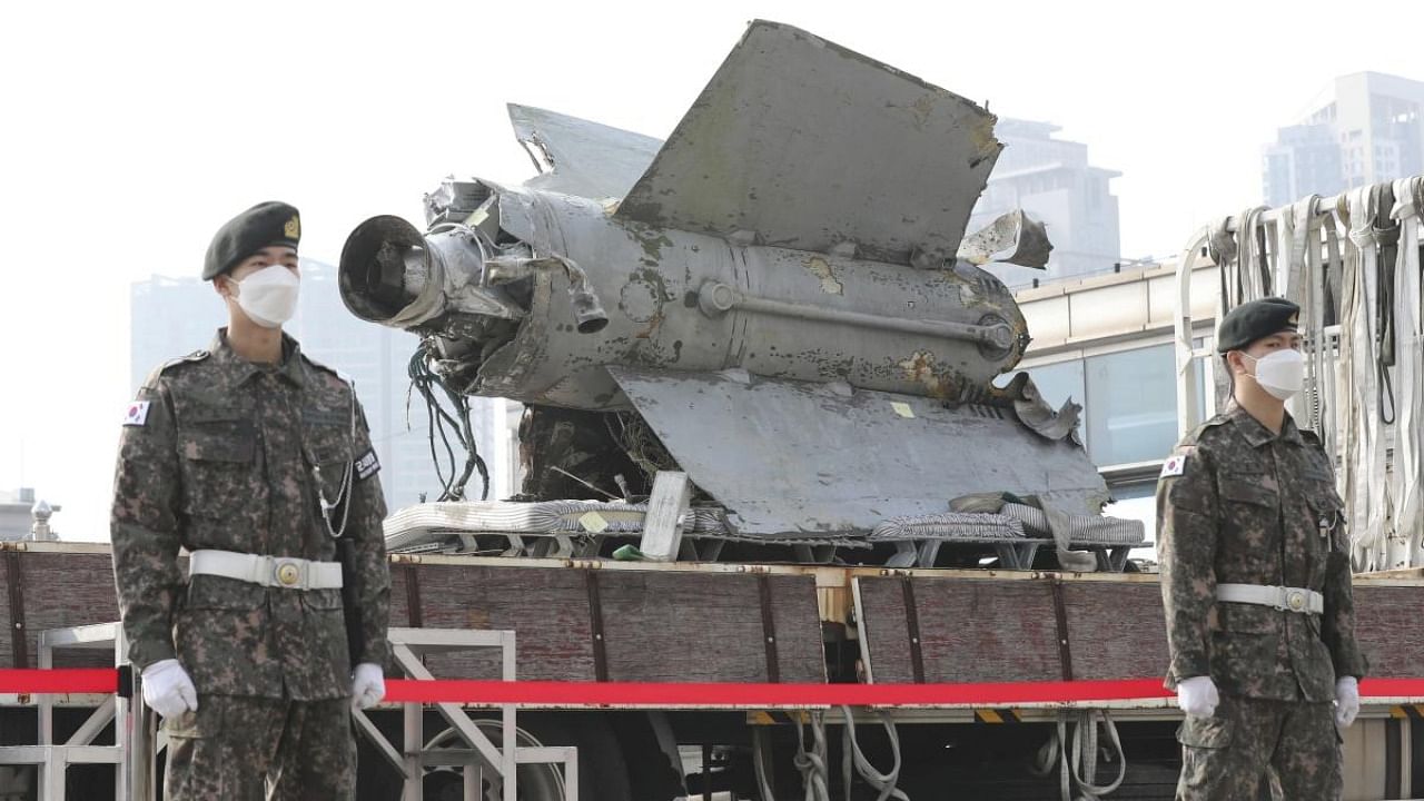 South Korean army soldiers stand in front of the debris of a missile which was identified as North Korea's SA-5 surface-to-air missile, at the Defense Ministry in Seoul, South Korea. Credit: AP Photo