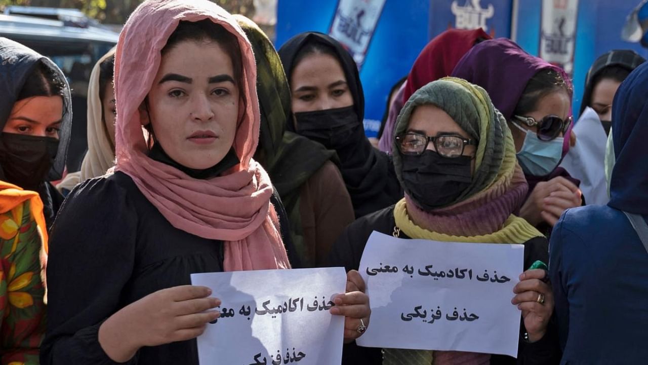 Afghan women hold placards protesting the Taliban crackdown on women's rights and freedoms. Credit: AFP Photo