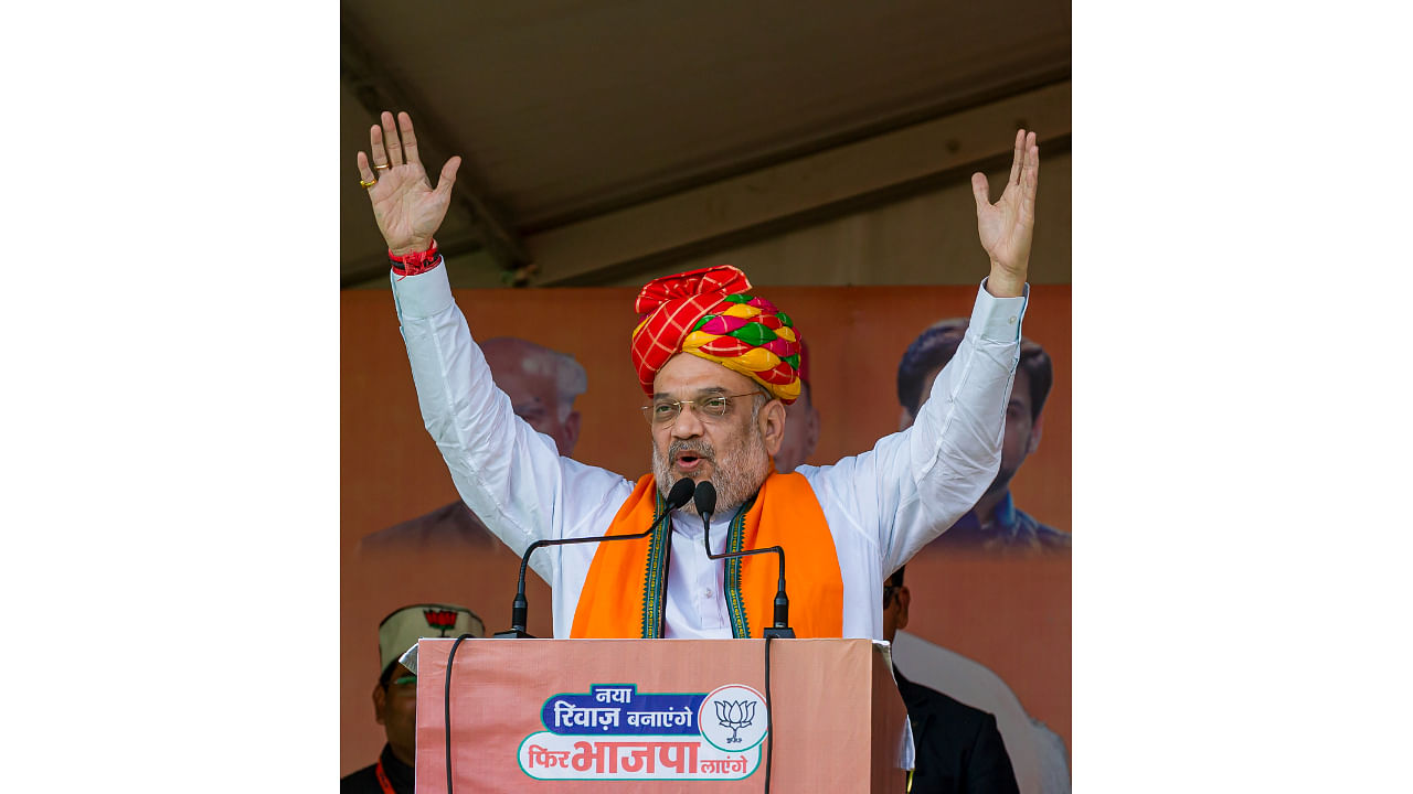 Union Home Minister and BJP leader Amit Shah addresses an election campaign rally ahead of Himachal Pradesh Assembly elections. Credit: PTI Photo