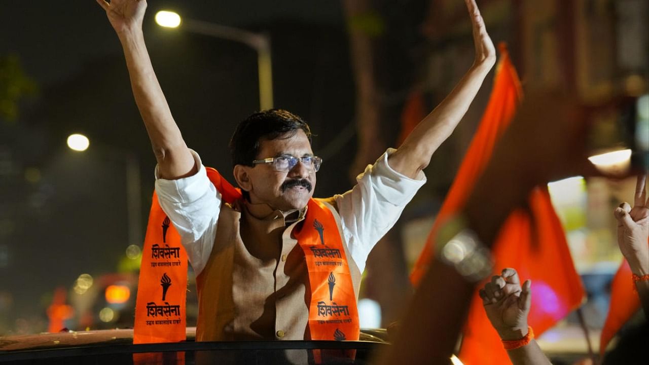 Shiv Sena leader Sanjay Raut waves at supporters following his release from Arthur Road Jail. Credit: PTI Photo