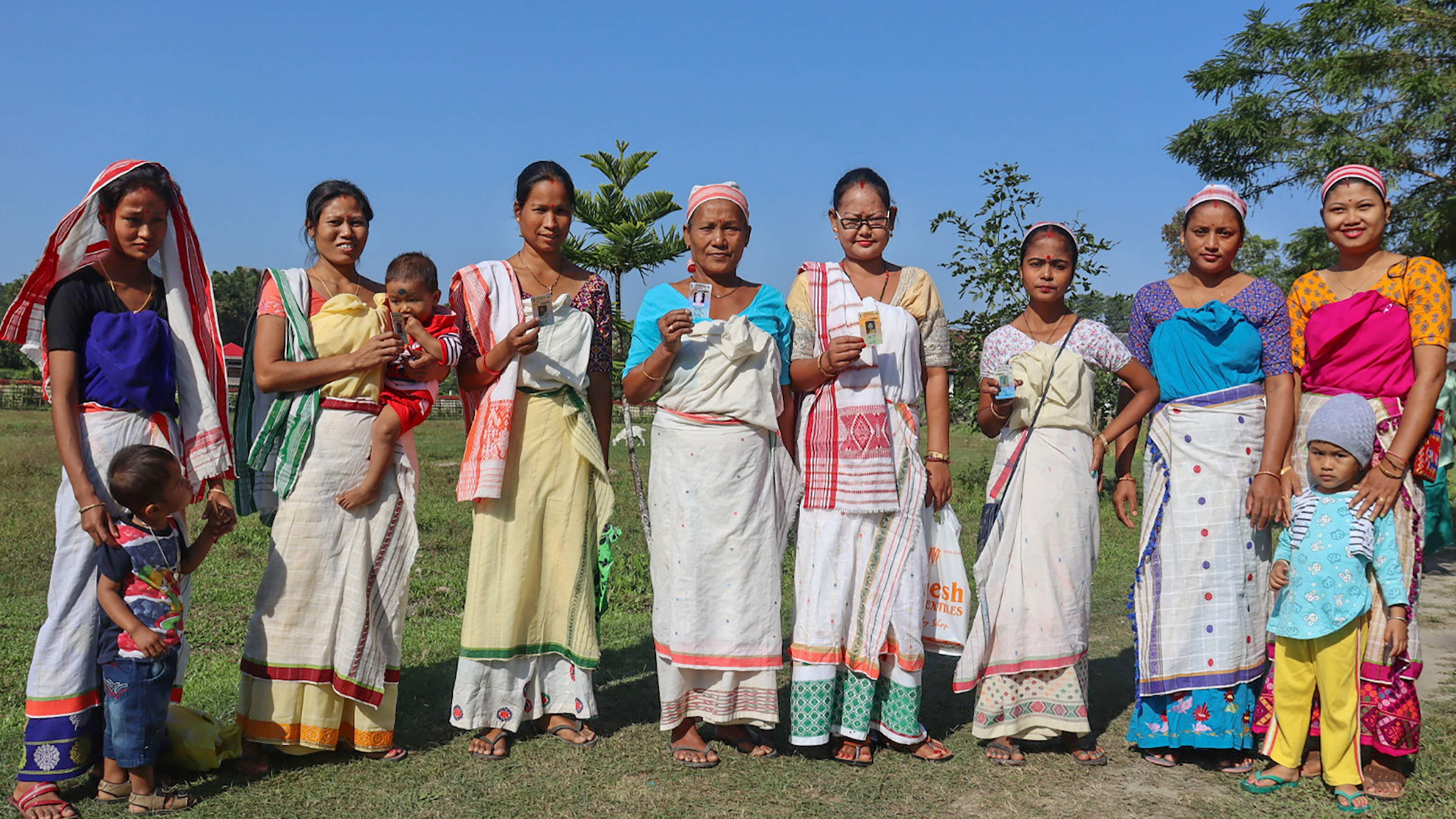 Women voters pose for photographs after casting their vote during the Deori Autonomous Council (DAC) elections, in Majuli island. Credit: PTI Photo