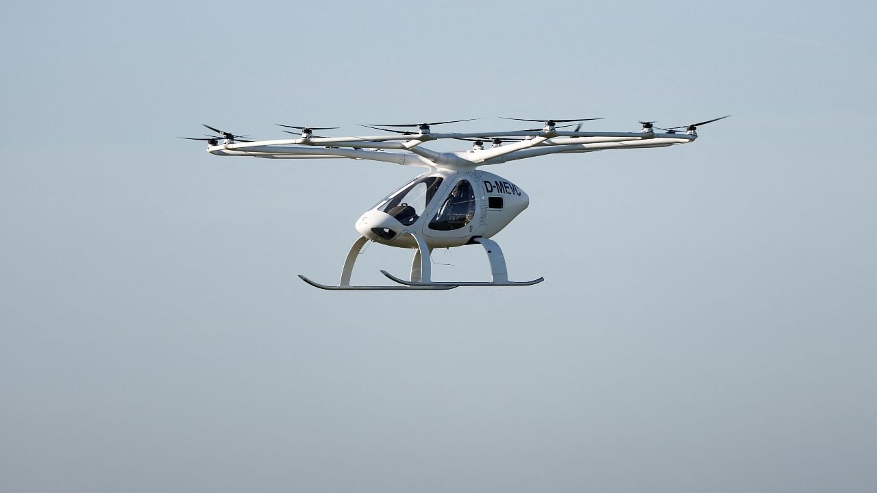 A Volocopter 2X drone taxi performs an integrated flight in conventional air traffic at Pontoise airfield in Cormeilles-en-Vexin, near Paris, France, November 10, 2022. Credit: Reuters Photo
