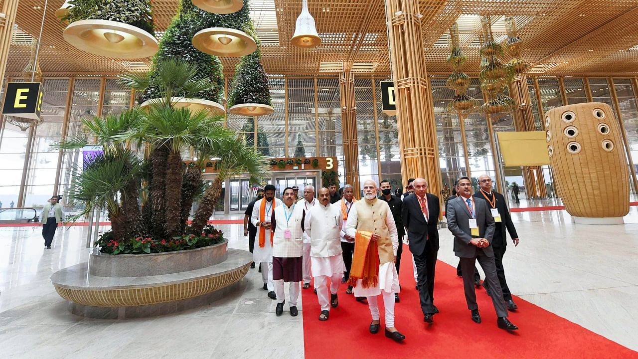 Prime Minister Narendra Modi with Union Minister Pralhad Joshi, Karnataka CM Basavaraj Bommai and others at the newly-inaugurated Terminal 2 of Kempegowda International Airport, in Bengaluru, Friday, Nov. 11, 2022. Credit: PTI Photo