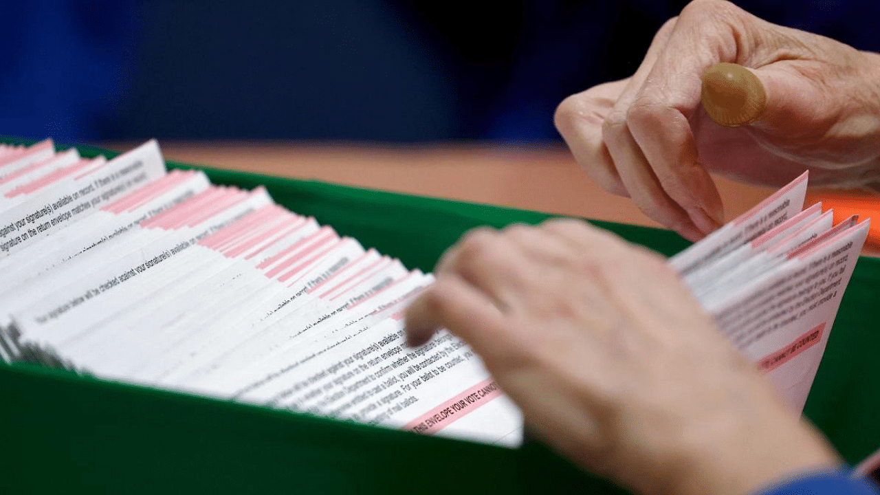 Ballots processing by an election worker during the election process on November 10, 2022 in North Las Vegas, Nevada. Credit: AFP Photo