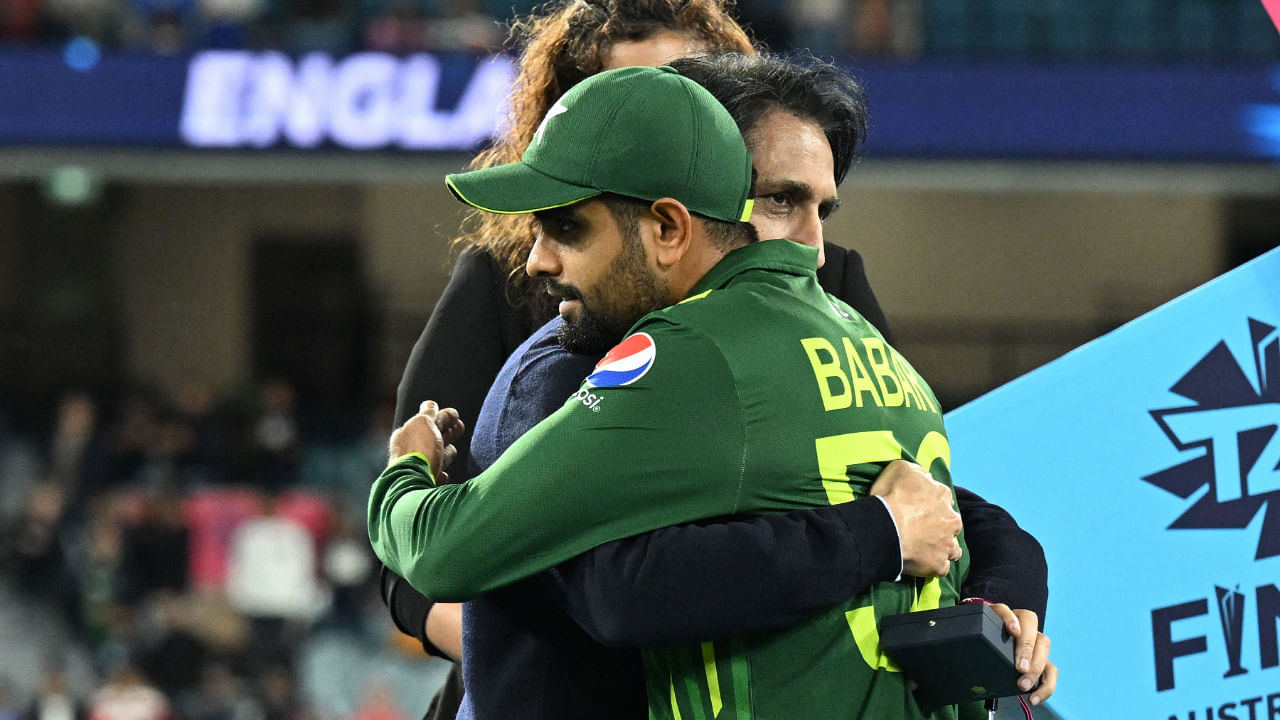 Pakistan's Captain Babar Azam (C) is embraced by Pakistan Cricket Board (PCB) Chairman Ramiz Raja after defeat in the ICC men's Twenty20 World Cup 2022 final cricket match England and Pakistan at The Melbourne Cricket Ground (MCG) in Melbourne. Credit: AFP Photo