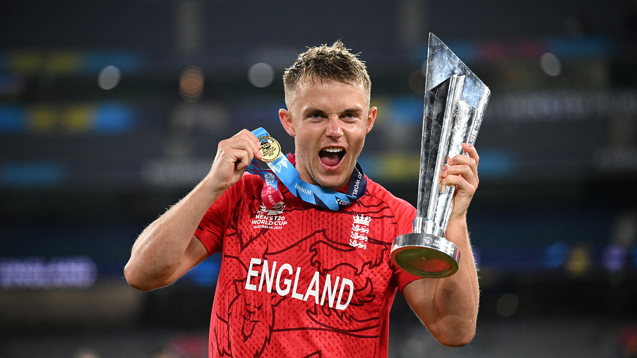 England's Sam Curran celebrates winning the T20 World Cup with the trophy. Credit: AAP Photo