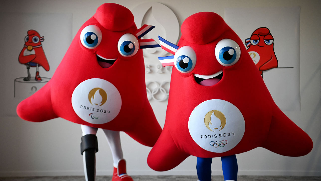 This photograph taken on November 10, 2022, shows the mascots for the Paris 2024 Olympic (R) and Paralympic (L) Games 'Les Phryges' in Saint-Denis, north of Paris. Credit: AFP Photo
