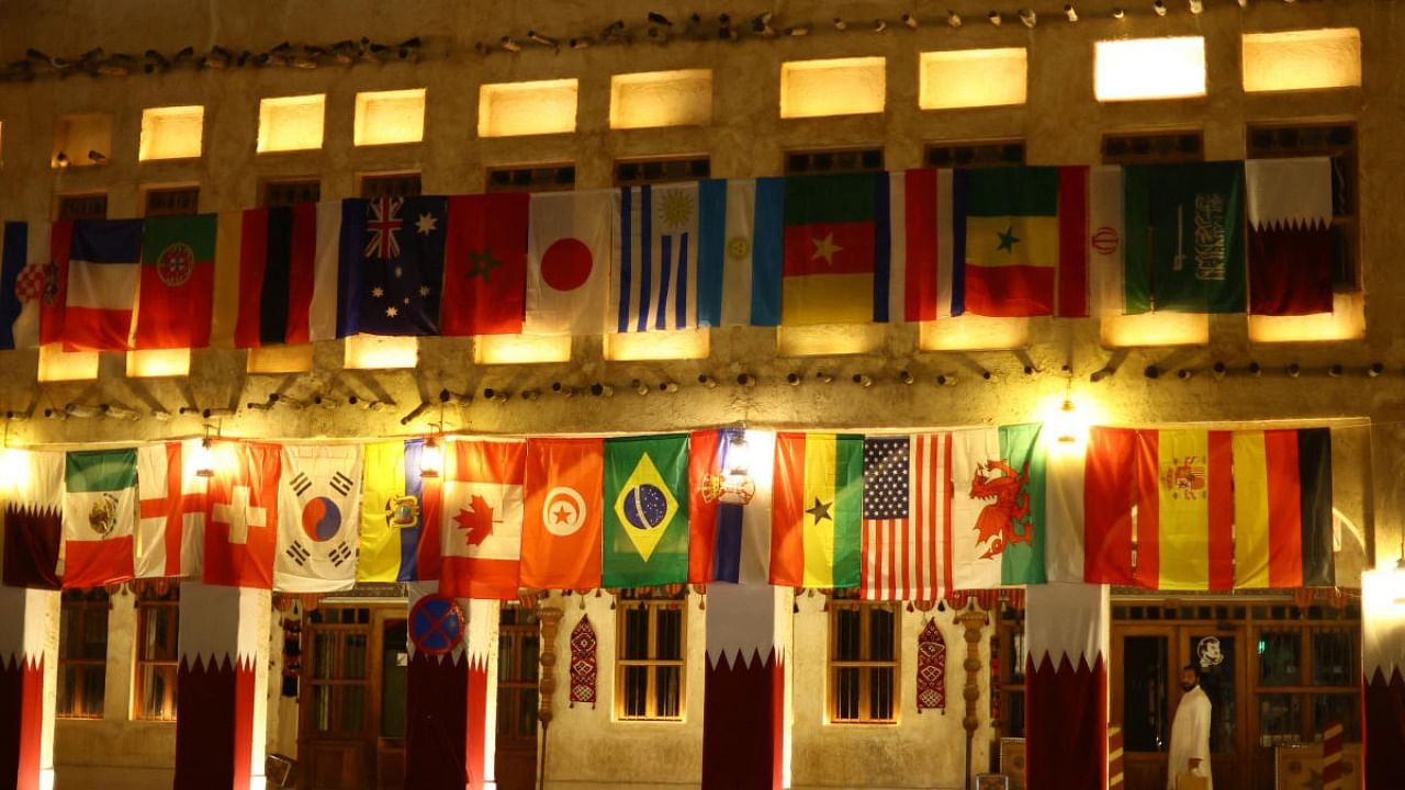 World Cup flags are seen on the exterior of a building in Souq Waqif, a traditional marketplace, ahead of the FIFA World Cup. Credit: Reuters photo