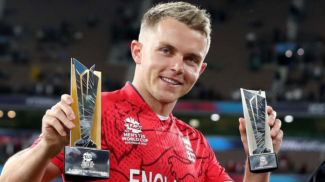 England's Sam Curran displays his trophies after the ICC men's Twenty20 World Cup 2022 Final. Photo Credit: AFP Photo