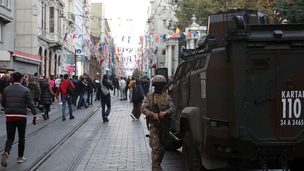 A member of the security forces walks near the scene after the explosion on busy pedestrian Istiklal street in Istanbul. Credit: Reuters Photo