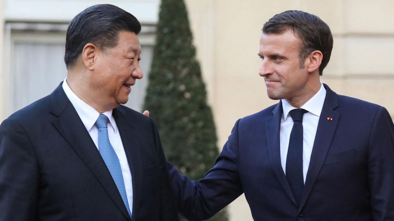 Chinese president Xi Jinping with French president Emmanuel Macron. Credit: AFP Photo