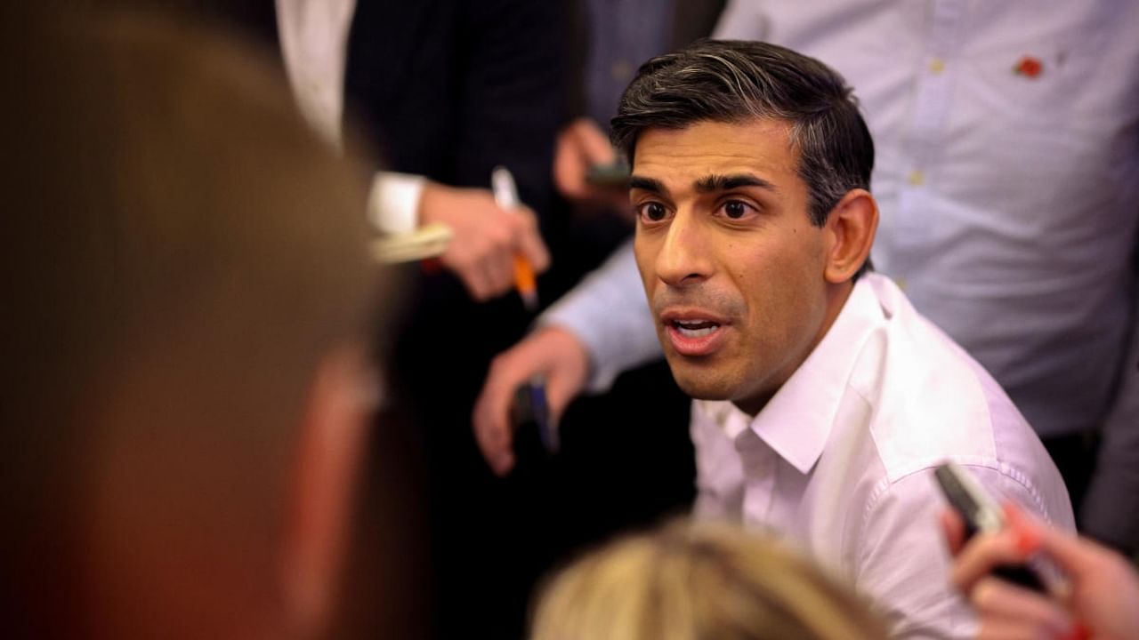 British Prime Minister Rishi Sunak holds a "huddle" news conference with political journalists aboard a government plane inflight to Indonesia to attend the G20 meeting, November 13, 2022. Credit: Reuters Photo