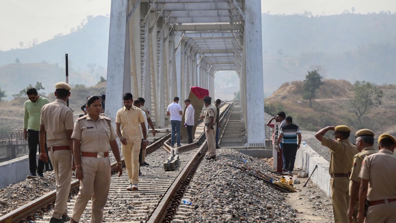 Police personnel probe after an explosion on Udaipur-Ahmedabad railway track in Udaipur. Photo Credit: PTI Photo