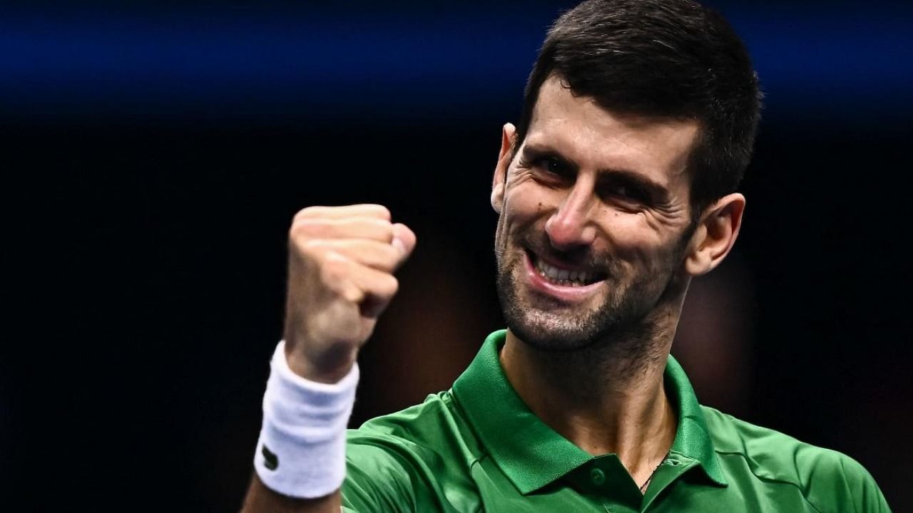 Novak Djokovic celebrates after winning his first round-robin match against Greece's Stefanos Tsitsipas at the ATP Finals. Photo Credit: AFP Photo