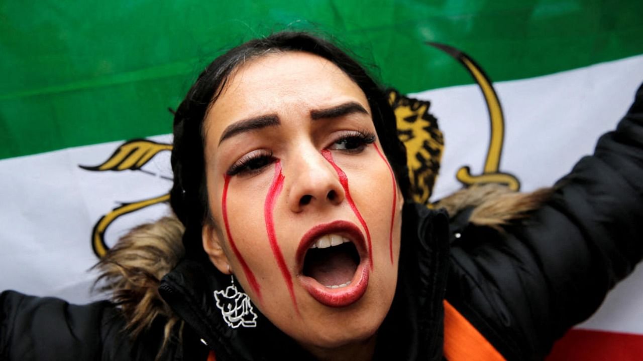 A demonstrator shouts slogans as she attends a protest in support of Iranian women, after the death of Mahsa Amini, near the Iranian consulate in Istanbul, Turkey November 7, 2022. Credit: Reuters Photo
