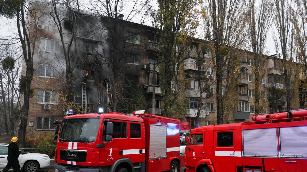 Firefighters work to put out a fire in a residential building hit by a Russian strike, amid Russia's attack on Ukraine, in Kyiv. Credit: Reuters Photo