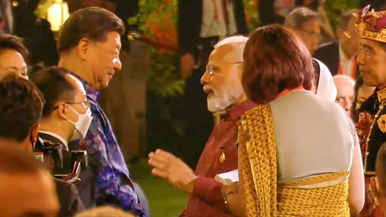 India's Prime Minister Narendra Modi with Chinese President Xi Jinping at the Welcoming Dinner during G20 Leaders' Summit, at the Garuda Wisnu Kencana Cultural Park, in Badung, Bali, Indonesia, on Tuesday, Nov. 15, 2022. Credit: PTI Photo