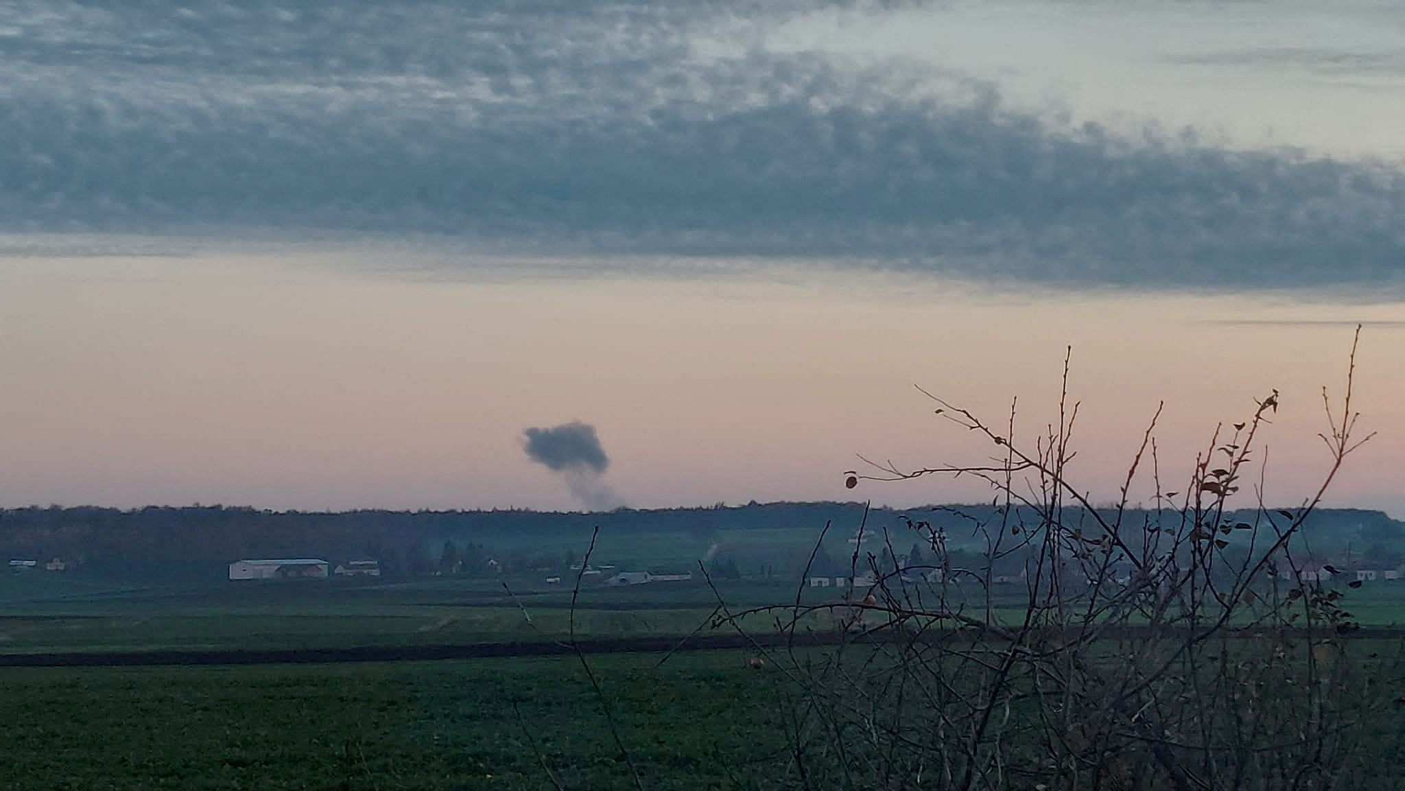 Smoke rises in the distance, amid reports of two explosions, seen from Nowosiolki, Poland, near the border with Ukraine. Credit: Social media via Reuters