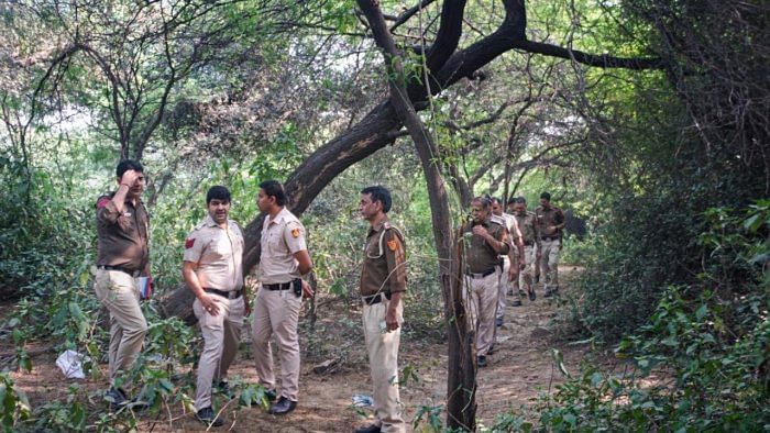 For a second time on Tuesday morning, a Delhi Police team took Aftab to the Mehrauli forest area to recover the remains. Credit: PTI Photo