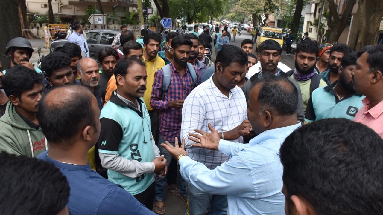 Delivery executives stage a protest at Jayanagar on Tuesday. Credit: DH Photo/B K Janardhan