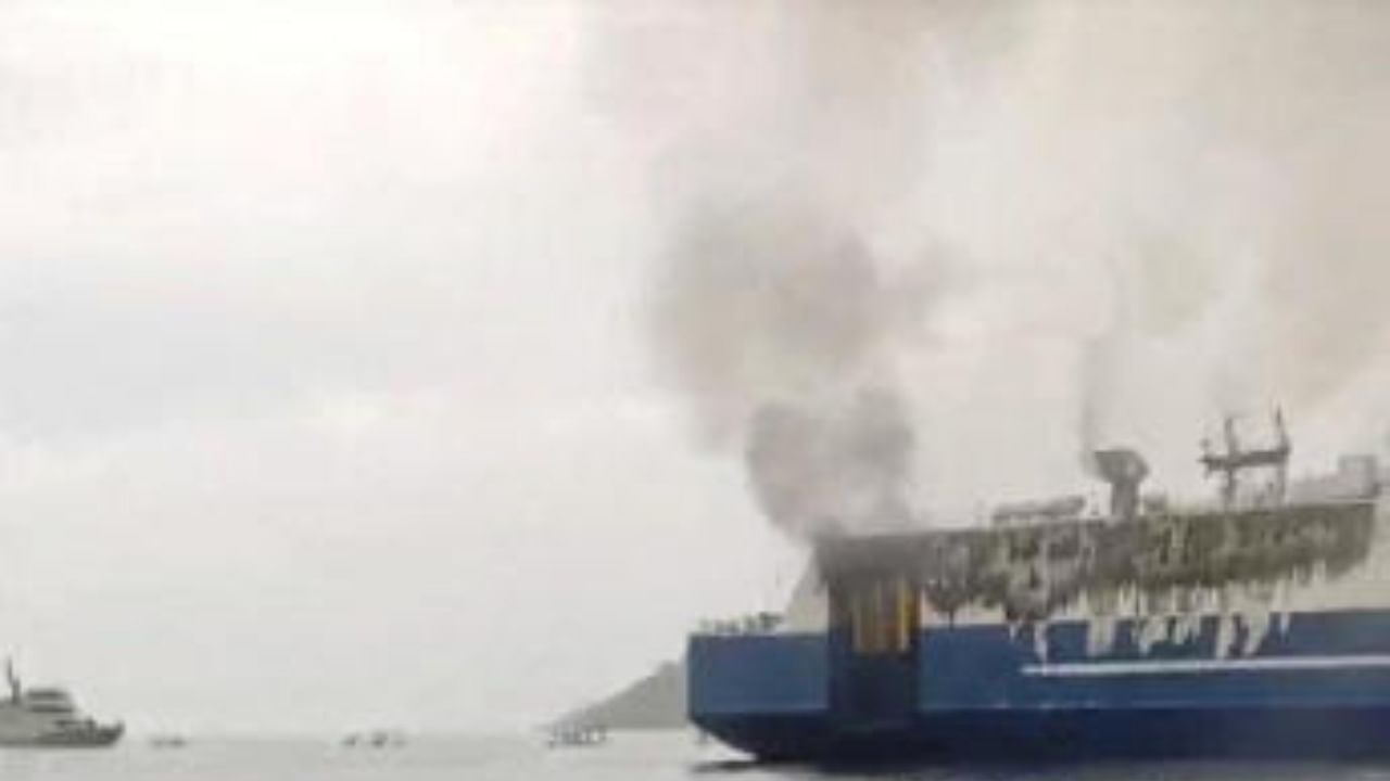 Smoke rises from a burning ferry off the coast of Bunutan. Credit: I Wayan Edi/via Reuters