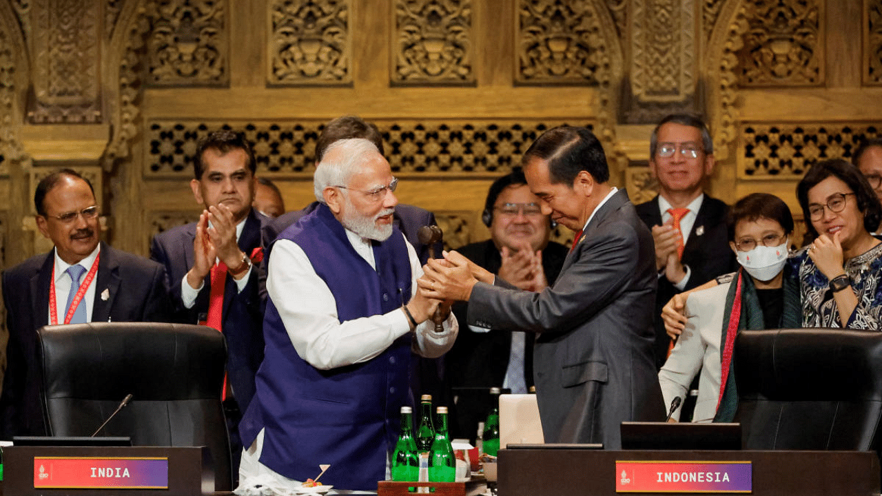 India's PM Narendra Modi and Indonesia's President Joko Widodo take part in the handover ceremony at the G20 Leaders' Summit. Credit: Reuters Photo