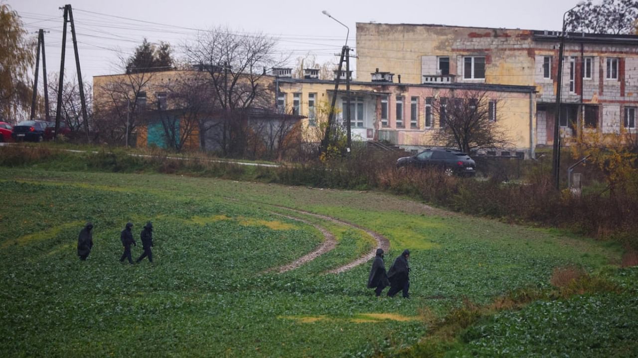 Police officers walk near the site of an explosion in Przewodow, a village in eastern Poland near the border with Ukraine. Credit: Reuters Photo