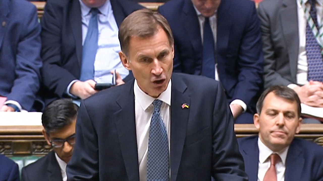 A video grab from footage broadcast by the UK Parliament's Parliamentary Recording Unit (PRU) shows Britain's Chancellor of the Exchequer Jeremy Hunt making an autumn budget statement in the House of Commons in London on November 17, 2022. Credit: AFP Photo