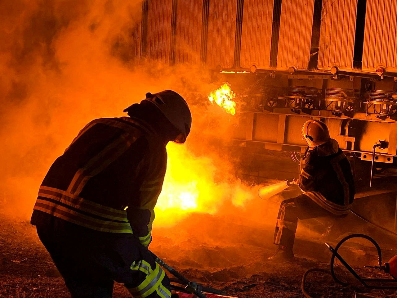 Firefighters work to put out a fire at energy infrastructure facilities, damaged by Russian missile strike, as Russia's attack on Ukraine continues, in Kyiv region. Credit: Reuters Photo