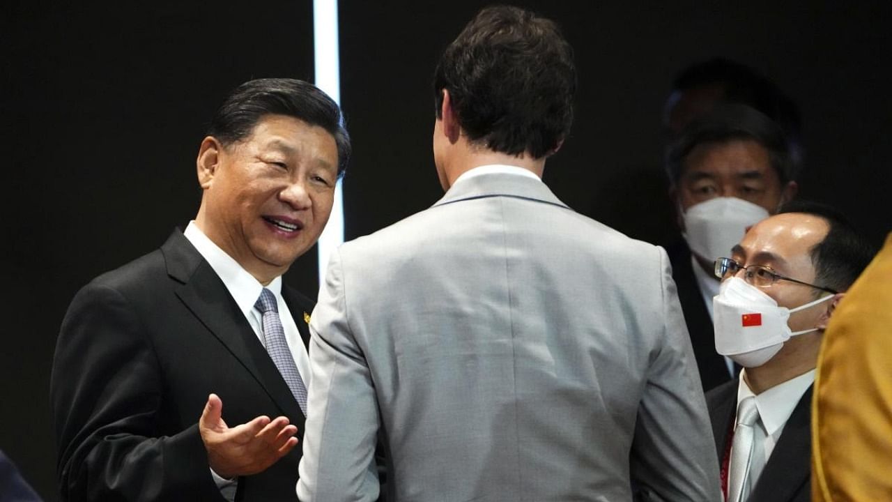 Canada Prime Minister Justin Trudeau talks with Chinese President Xi Jinping after taking part in the closing session at the G20 Leaders Summit in Bali. Credit: AP/PTI Photo