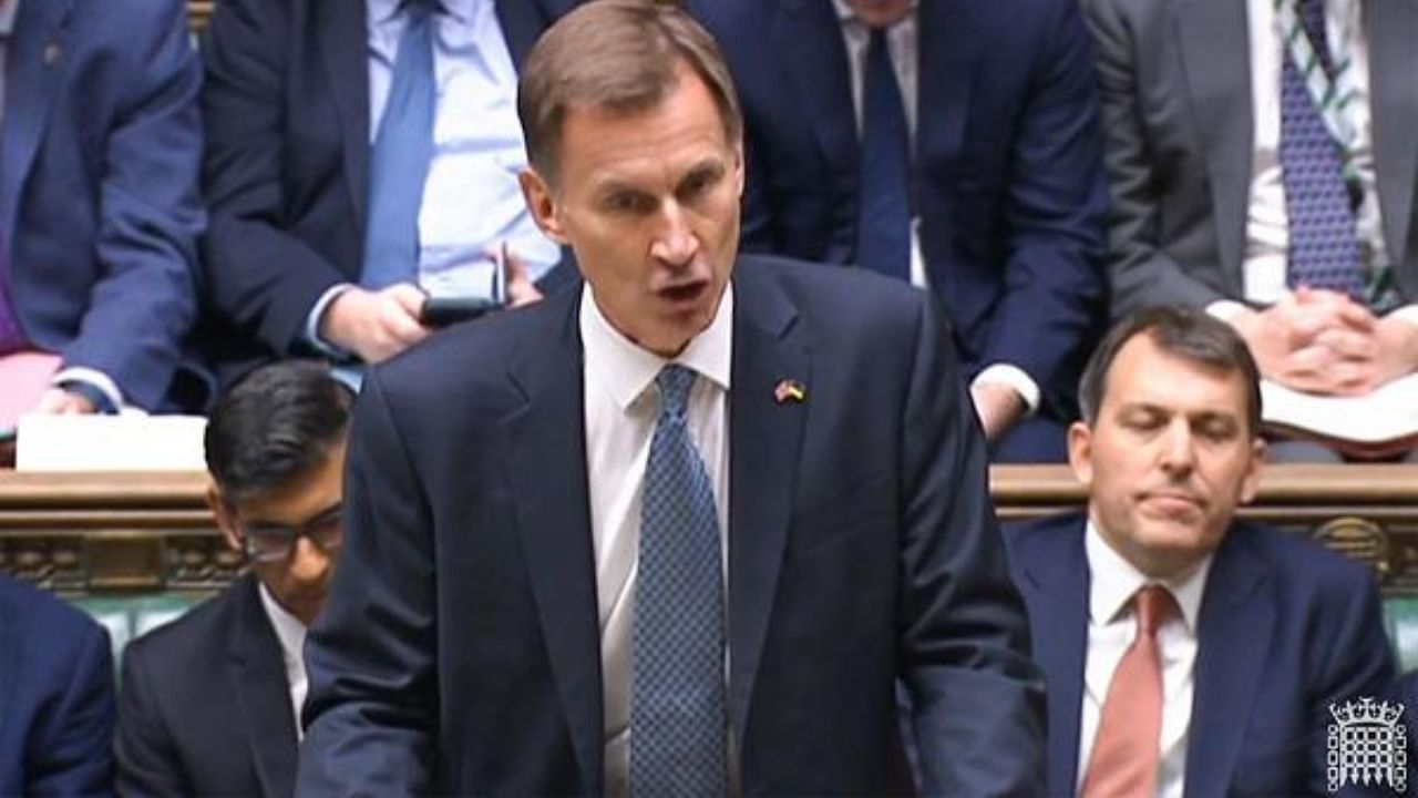 Jeremy Hunt making the autumn budget statement. Credit: AFP Photo/PRU