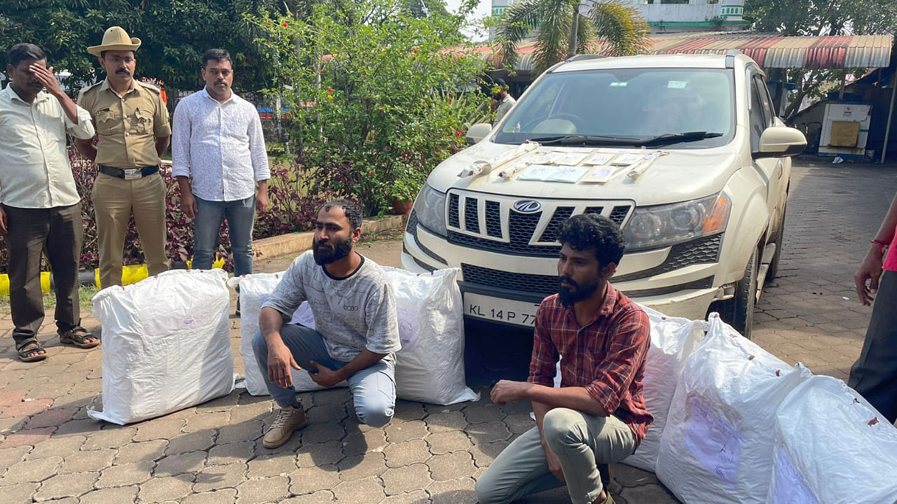 Accused youth Abdul Khader Haris and Rameez alias Raaz seen with 132 kg of ganja and the vehicle. Credit: Special Arrangement