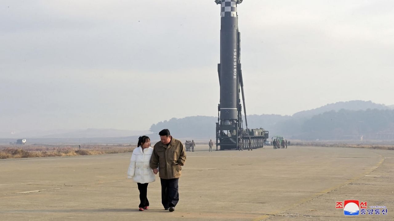 North Korean leader Kim Jong Un, along with his daughter, walks away from an intercontinental ballistic missile. Credit: Reuters/KCNA