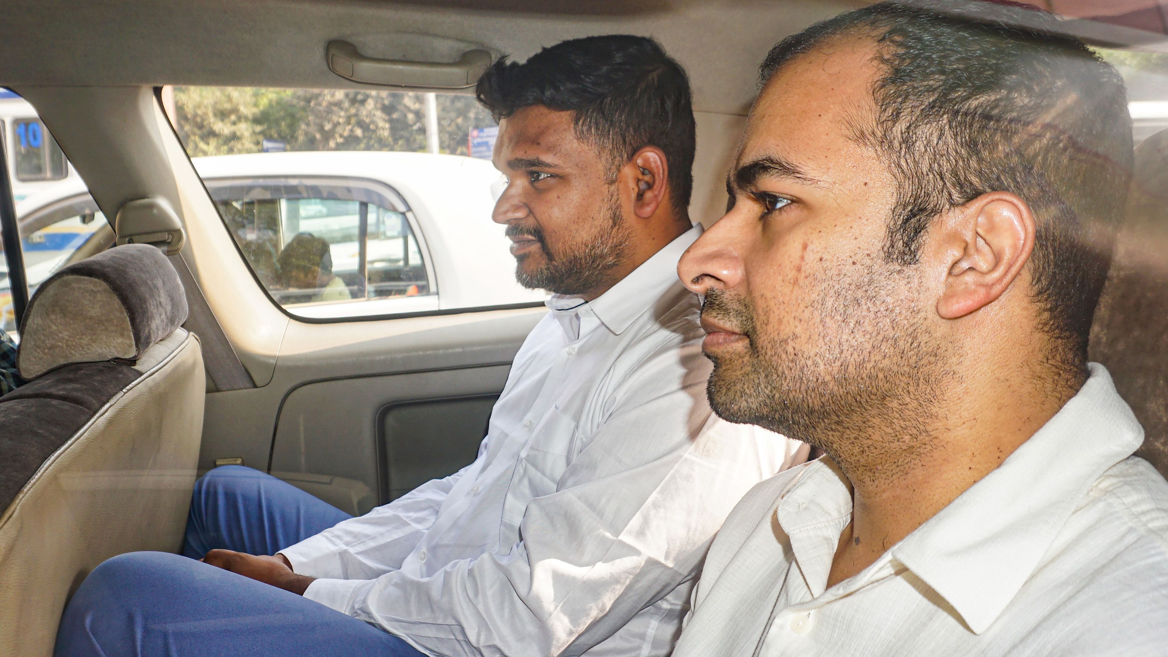 Businessman Abhishek Boinpally and AAP leader & businessman Vijay Nair being produced before a court for the hearing of the alleged Delhi excise policy scam case, in New Delhi, November 19. Credit: PTI Photo